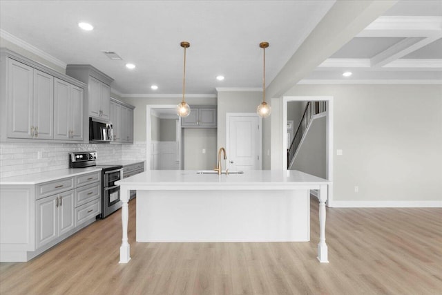 5511 Sweetwater Dr, Grovetown, GA 30813 - kitchen featuring stainless steel appliances, gray cabinetry, ornamental molding, light wood finished floors, and a breakfast bar area