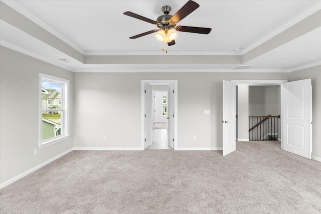 5511 Sweetwater Dr, Grovetown, GA 30813 - unfurnished bedroom featuring crown molding, carpet, a tray ceiling, and a ceiling fan