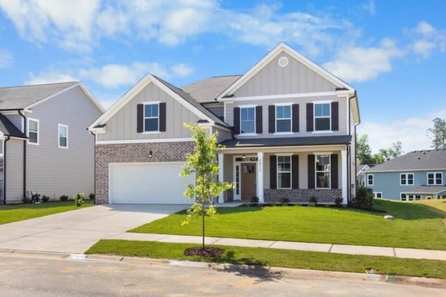 5511 Sweetwater Dr, Grovetown, GA 30813 - craftsman-style home featuring board and batten siding, brick siding, concrete driveway, an attached garage, and covered porch