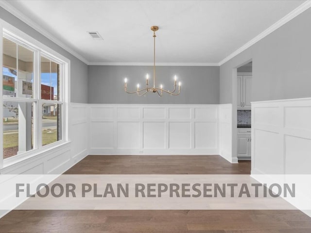 unfurnished dining area with crown molding, a healthy amount of sunlight, and an inviting chandelier