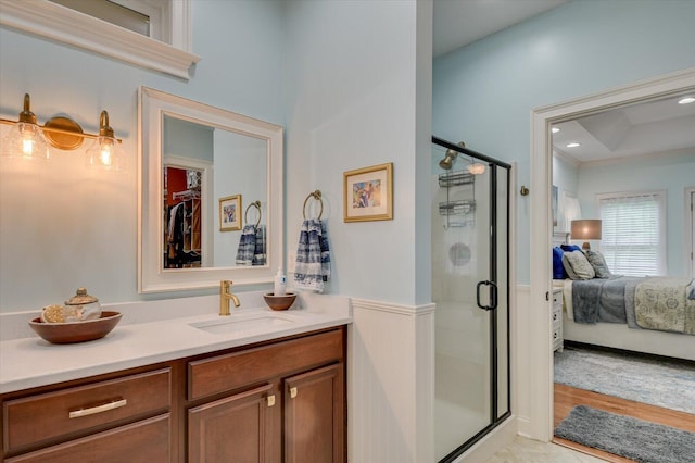 bathroom featuring vanity, tile patterned floors, and walk in shower