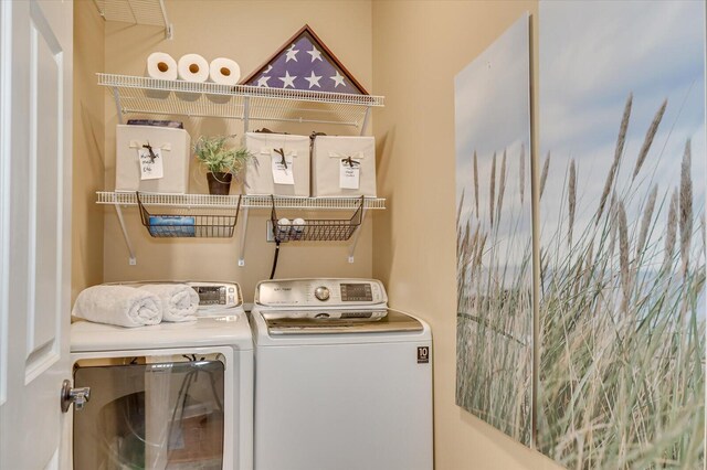 laundry room with independent washer and dryer