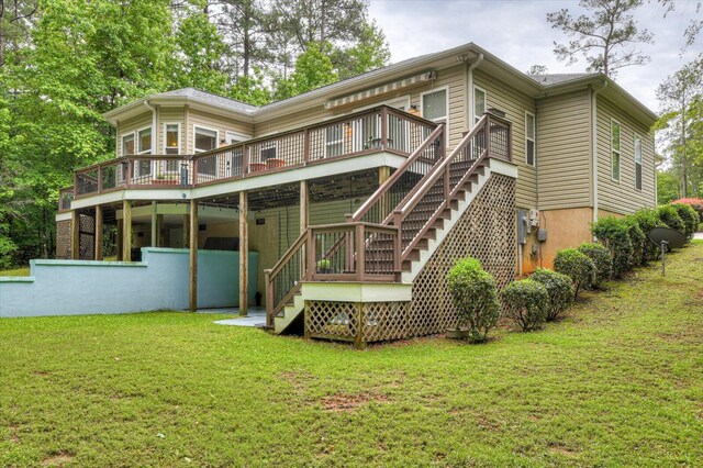 back of house with a yard and a deck