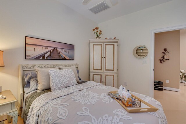 bedroom featuring ceiling fan and vaulted ceiling