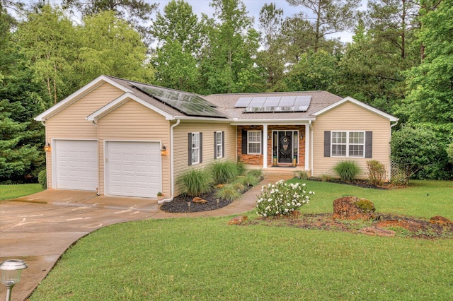 ranch-style house featuring covered porch, a front lawn, a garage, and solar panels