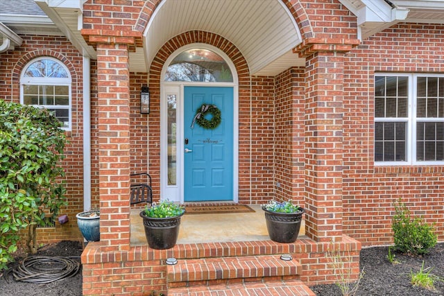 property entrance with brick siding