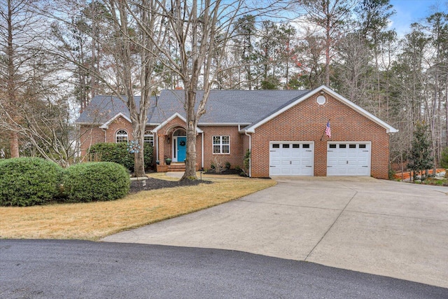 view of front of property with brick siding, a shingled roof, concrete driveway, an attached garage, and a front yard