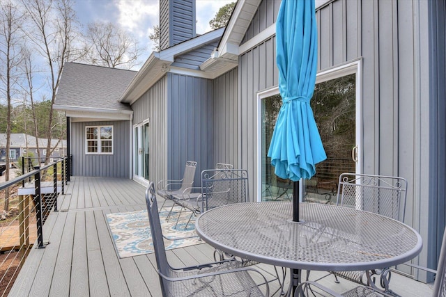 deck featuring outdoor dining area