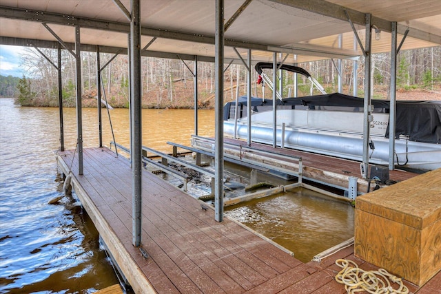 dock area featuring a water view and boat lift