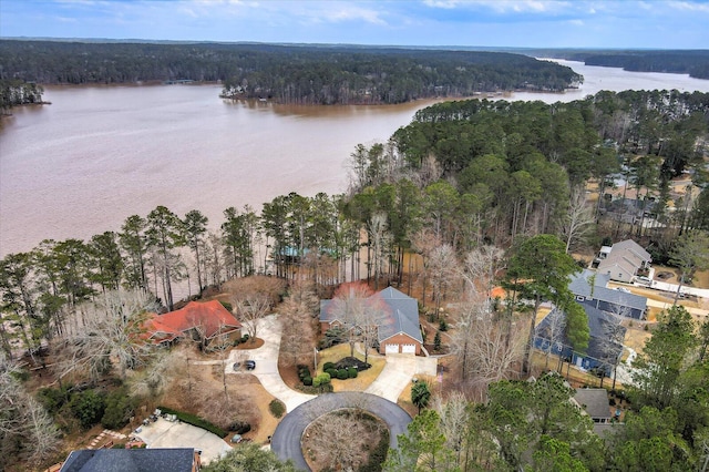 aerial view featuring a water view and a forest view