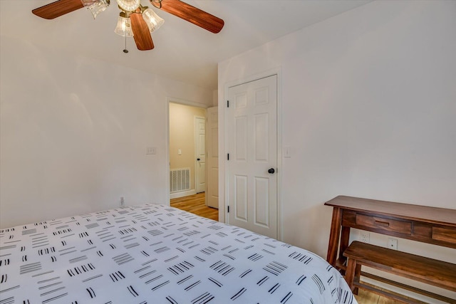 bedroom with visible vents and a ceiling fan