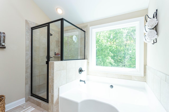 full bath featuring a garden tub and a stall shower