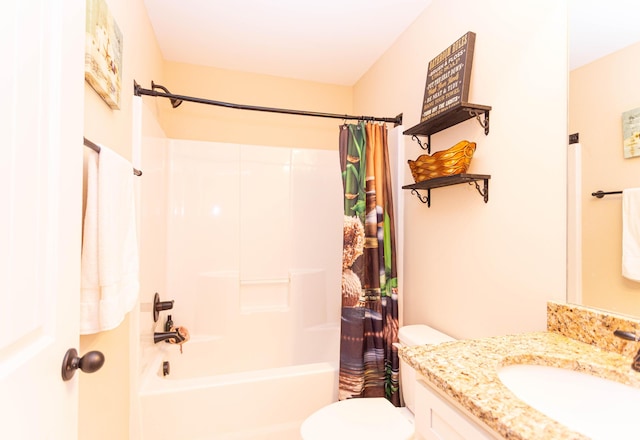 full bath with toilet, shower / bath combo, and vanity