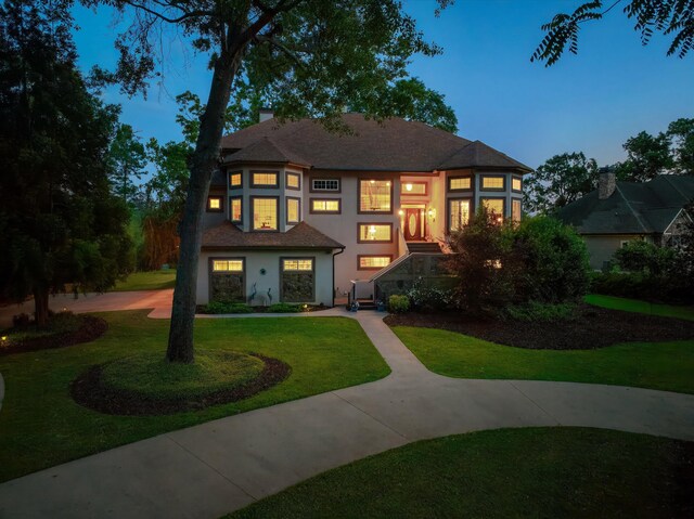 197 River Bend Dr, Clarks Hill, SC 29821 - view of front facade featuring stucco siding, a front yard, and a chimney