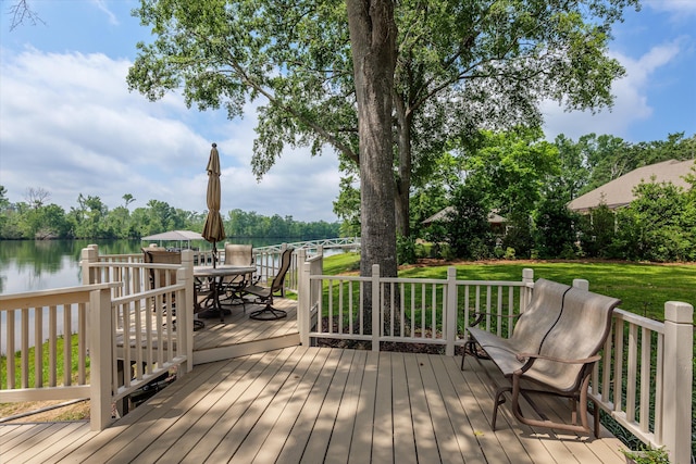 197 River Bend Dr, Clarks Hill, SC 29821 - wooden terrace with outdoor dining space, a lawn, and a water view