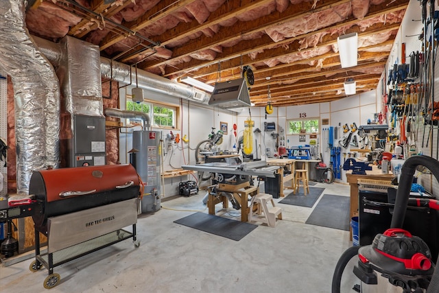 197 River Bend Dr, Clarks Hill, SC 29821 - garage with gas water heater and a workshop area