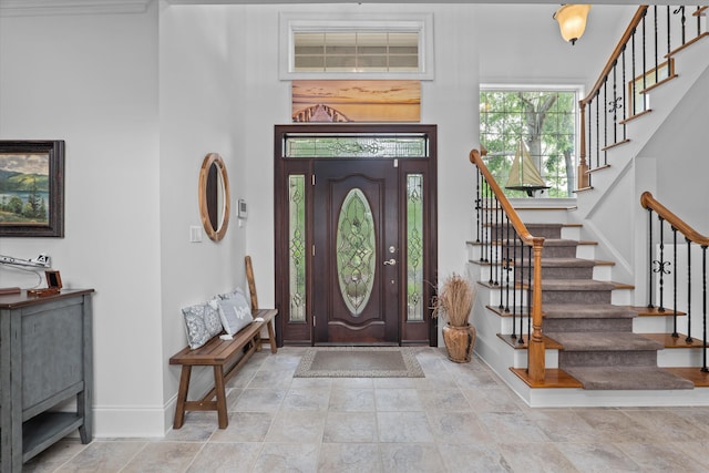 197 River Bend Dr, Clarks Hill, SC 29821 - entrance foyer featuring baseboards, stairway, a towering ceiling, and stone finish floors