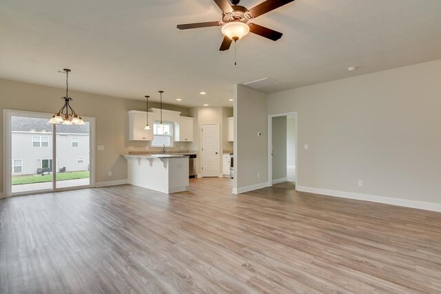 spare room featuring light hardwood / wood-style floors and ceiling fan