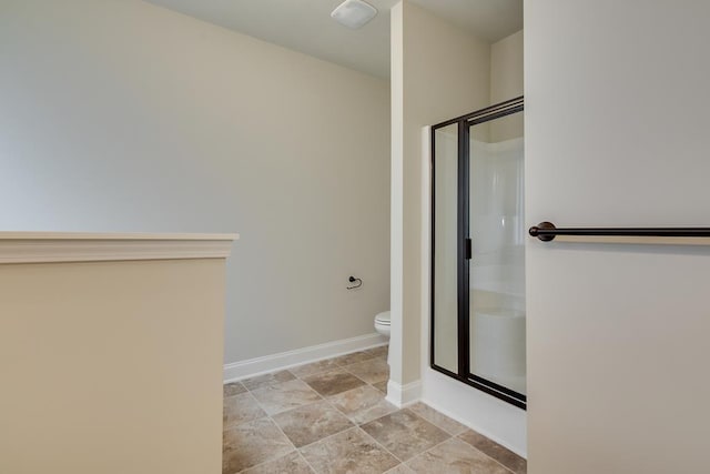 bathroom with toilet and walk in shower