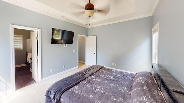 2054 Dundee Way, Grovetown, GA 30813 - tiled bedroom featuring crown molding, carpet, baseboards, a tray ceiling, and a ceiling fan