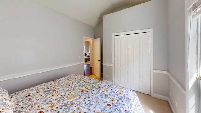2054 Dundee Way, Grovetown, GA 30813 - bedroom featuring vaulted ceiling, a closet, and light colored carpet