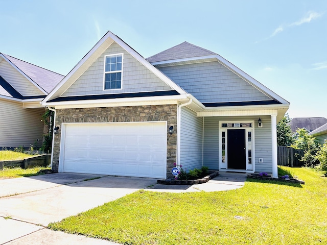 2054 Dundee Way, Grovetown, GA 30813 - craftsman-style house with stone siding, a front yard, an attached garage, and concrete driveway