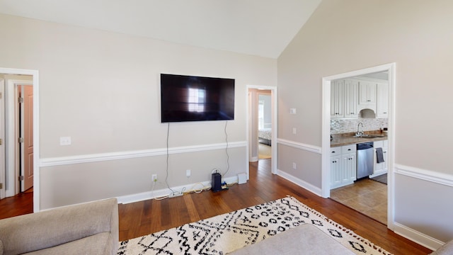 2054 Dundee Way, Grovetown, GA 30813 - living room featuring wood finished floors, high vaulted ceiling, and baseboards