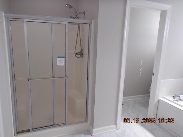 967 Windmill Pkwy, Evans, GA 30809 - bathroom featuring a stall shower and a bath