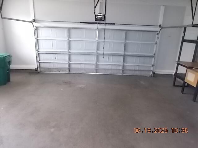 967 Windmill Pkwy, Evans, GA 30809 - garage with a garage door opener and baseboards