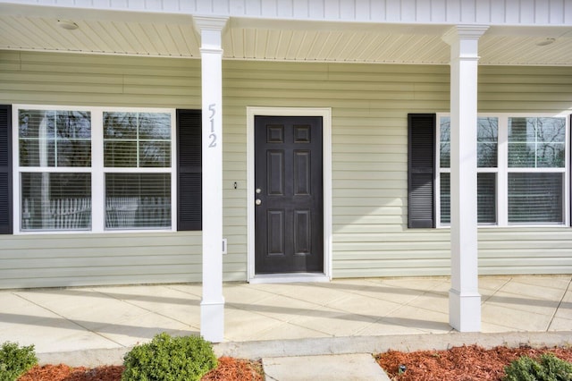 doorway to property with covered porch