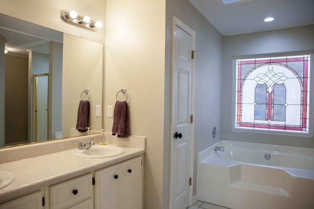 bathroom with tile patterned floors, vanity, and shower with separate bathtub