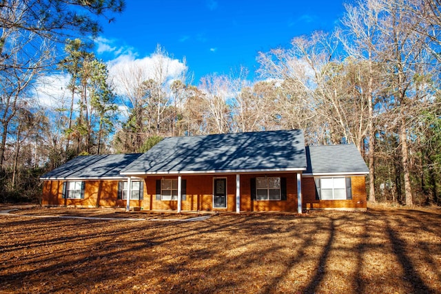 ranch-style house featuring a porch