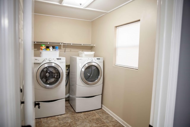 clothes washing area with independent washer and dryer