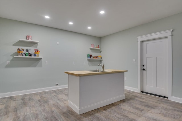 kitchen with light wood-type flooring and sink