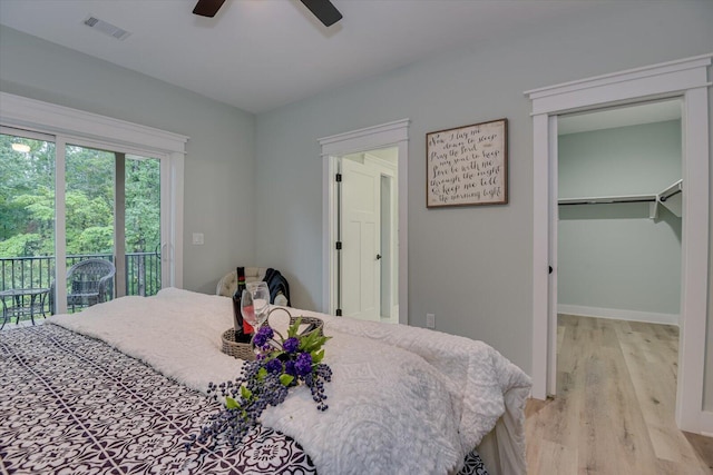 bedroom with access to outside, ceiling fan, a closet, and light hardwood / wood-style floors