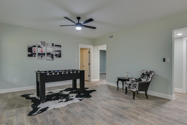 interior space with light wood-type flooring and ceiling fan