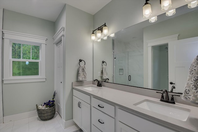 bathroom with vanity and a shower with shower door