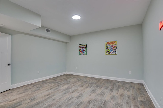 unfurnished room with light wood-type flooring