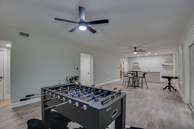 rec room featuring hardwood / wood-style flooring and ceiling fan