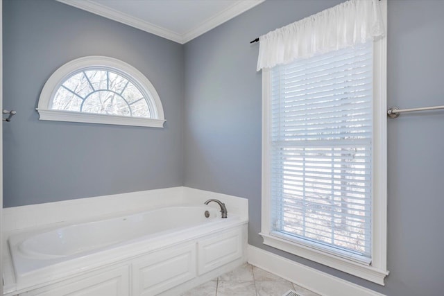 bathroom featuring ornamental molding, a bath, and baseboards