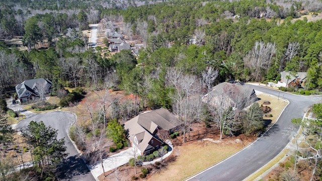 drone / aerial view with a view of trees