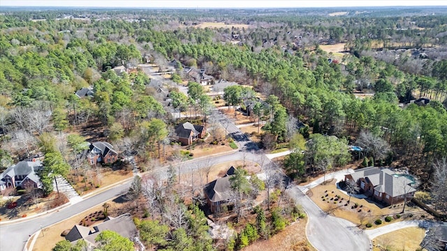 drone / aerial view with a view of trees