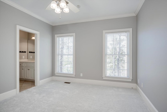 bedroom with baseboards, ornamental molding, and light colored carpet