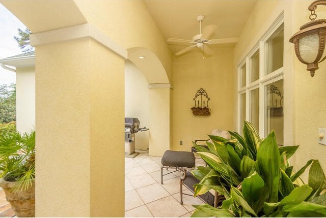 view of patio featuring ceiling fan