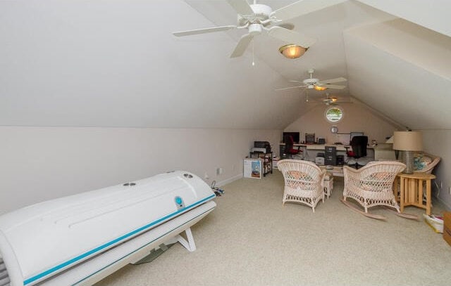 bedroom with carpet floors, ceiling fan, and lofted ceiling