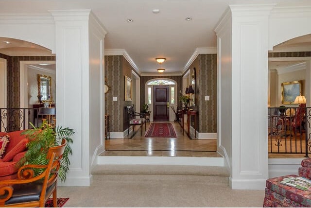 hall featuring ornamental molding