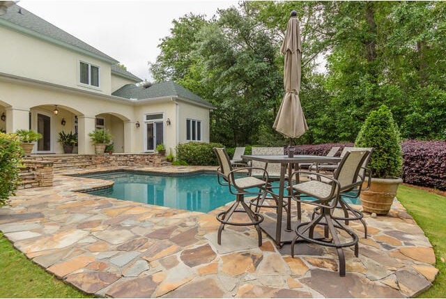 view of swimming pool featuring a patio area