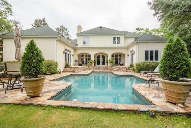 back of house featuring a patio and french doors