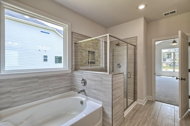 6 Belfast Ct, North Augusta, SC 29860 - full bathroom with healthy amount of natural light, a bath, a stall shower, and a ceiling fan