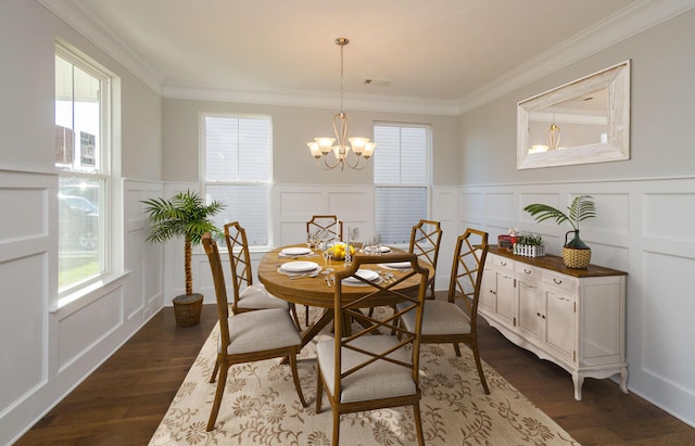 dining room with dark hardwood / wood-style floors, a notable chandelier, and ornamental molding